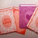 3D stamped book tags made of cardstock in coral and purple