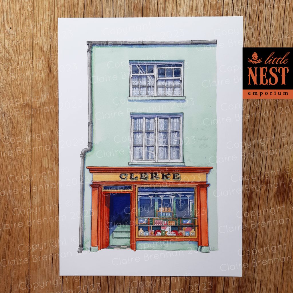 Watercolour painting of Clerke's of Skibbereen the traditional grocers shop. The shop is minty green with strong orange and yellow joinery around the door and window.