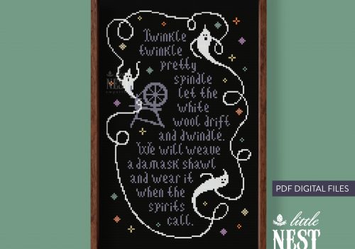 A bron frame surrounds a piece of black cloth on which is cross stitched a poem and three white ghost shapes.